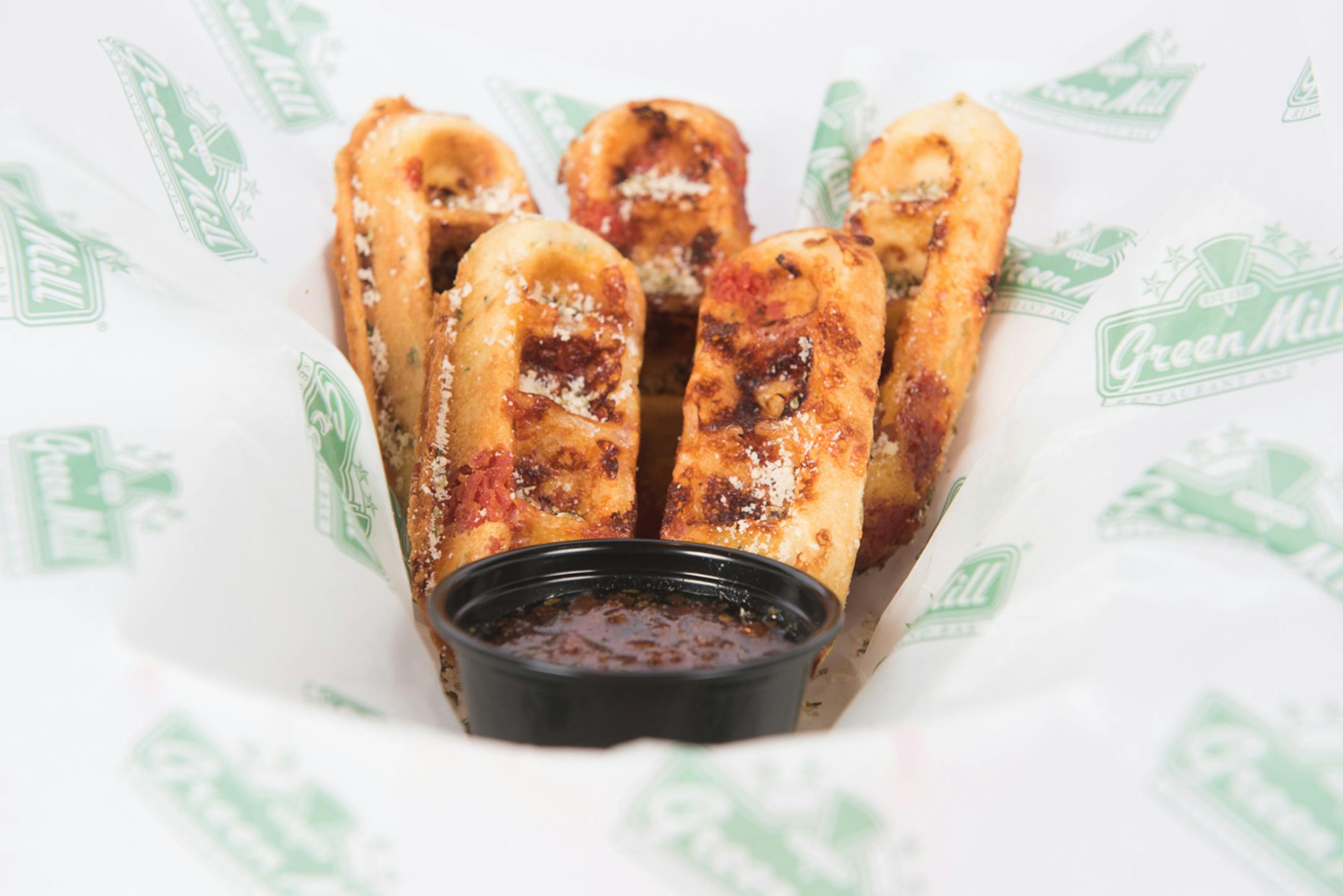 Za-Waffle Sticks: Waffles blended with pepperoni and mozzarella, topped with a parmesan herb blend and served with pepperoni-infused maple syrup or marinara sauce. At Green Mill, located on the east side of Cooper St. between Randall & Wright avenues, at Family Fair at Baldwin Park.