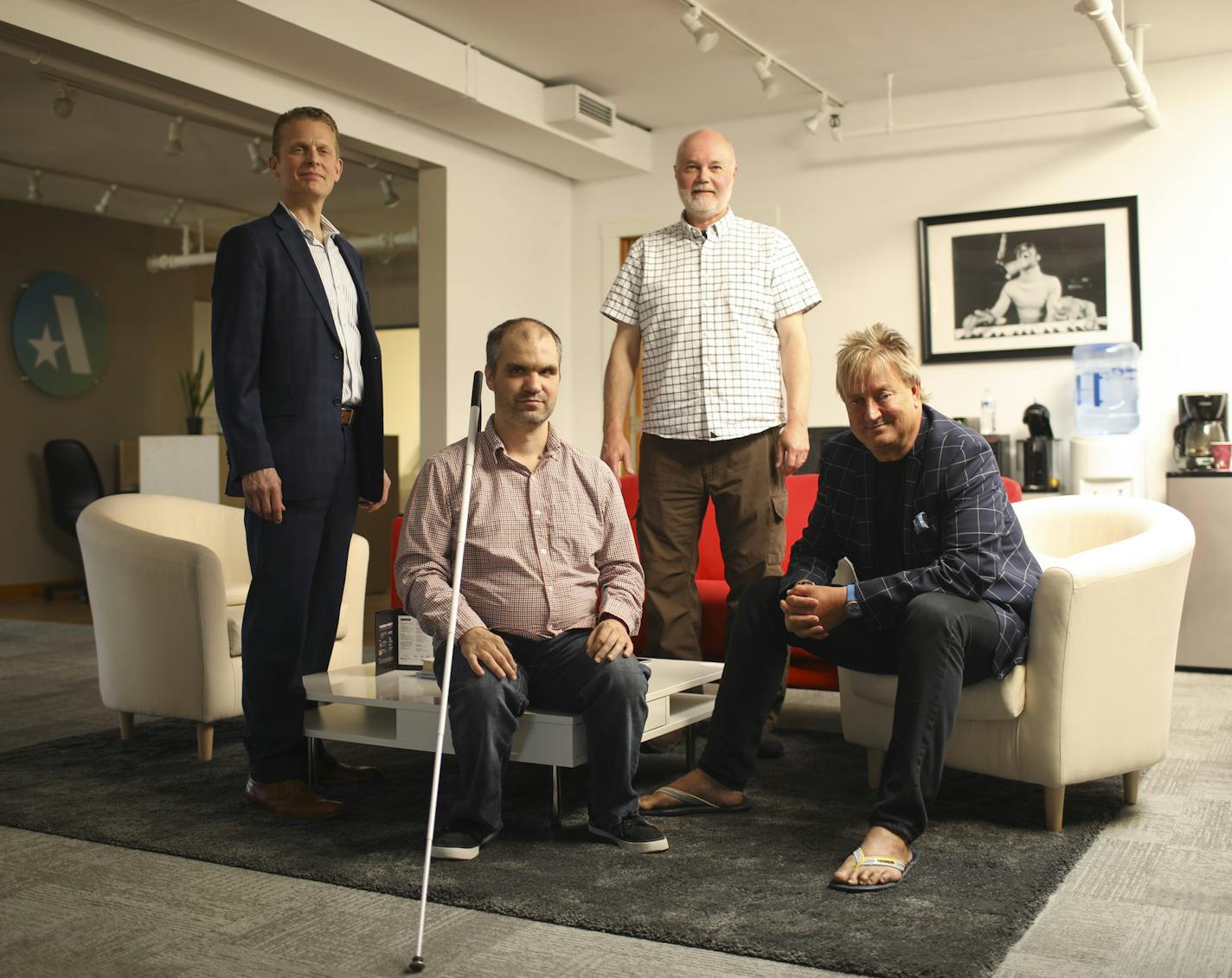 Two Accessible360 co-founders, Aaron Cannon, left foreground, and Mark Lacek, right foreground. With them were Douglas Hegley, left, and Doug Krukowski.