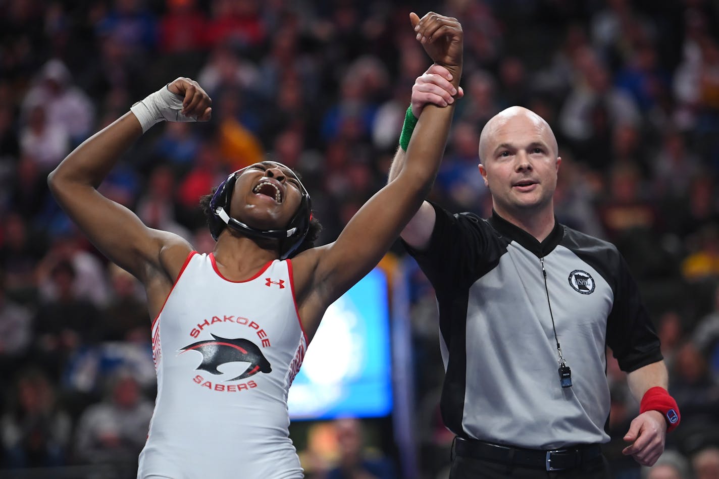 Shakopee's Joel Makem celebrates her win over Park Center's Rodiat Adeduntan in the 126lb final during the Minnesota State High School girls Wrestling Championships Saturday, March 5, 2022 at Xcel Energy Center in St. Paul, Minn. ] AARON LAVINSKY • aaron.lavinsky@startribune.com