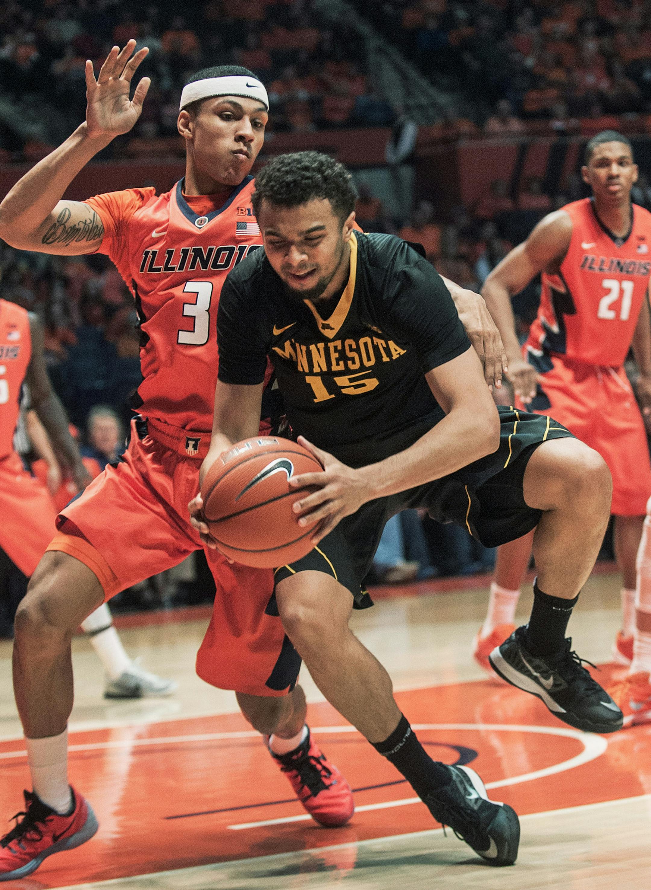 Minnesota guard Stephon Sharp (15) looses his balance while being guarded by Illinois guard Khalid Lewis (3) in the second half of an NCAA College basketball game in Champaign, Ill., Sunday, Feb. 28, 2016. Illinois won 84-71. (AP Photo/Rick Danzl) ORG XMIT: ILRD109