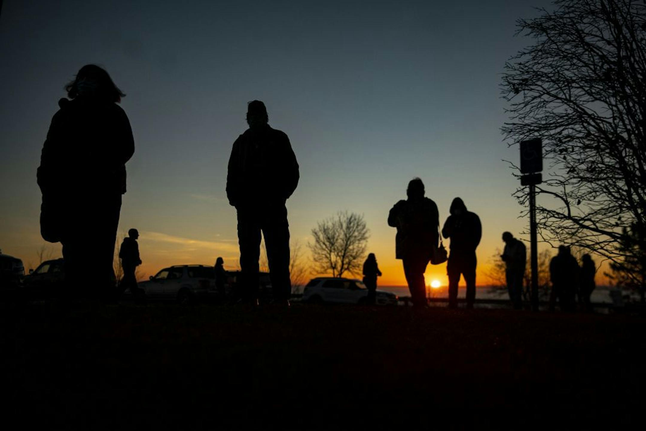 A long line of voters formed outside of First United Methodist Church as the sun rose over Lake Superior in Duluth on Tuesday morning.