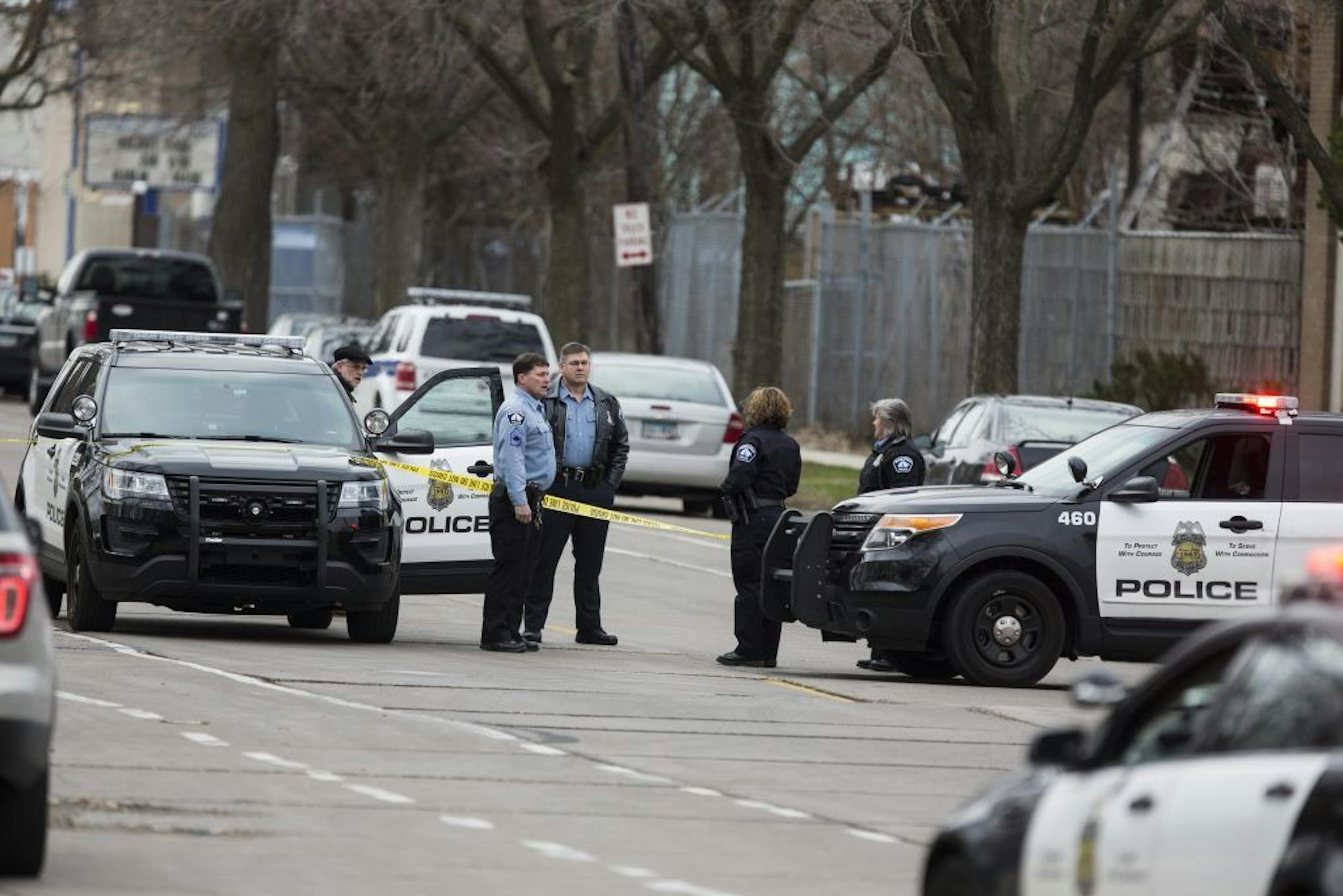 Officers from the Minneapolis Police Department stand guard outside the scene of a possible officer involved shooting in Minneapolis.