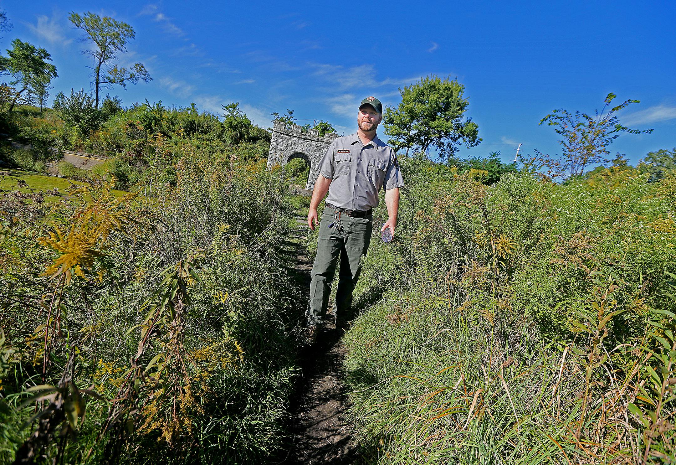 Neil Smarjesse, a National Park Service Land Manager and Biologist, made his way through Coldwater, Tuesday, September 13, 2016 in Minneapolis, MN. The 27-acre tract that once housing cutting-edge federal mining research has made big steps toward returning to the oak savanna prairie that the builders of Fort Snelling encountered when they arrived. ] (ELIZABETH FLORES/STAR TRIBUNE) ELIZABETH FLORES • eflores@startribune.com