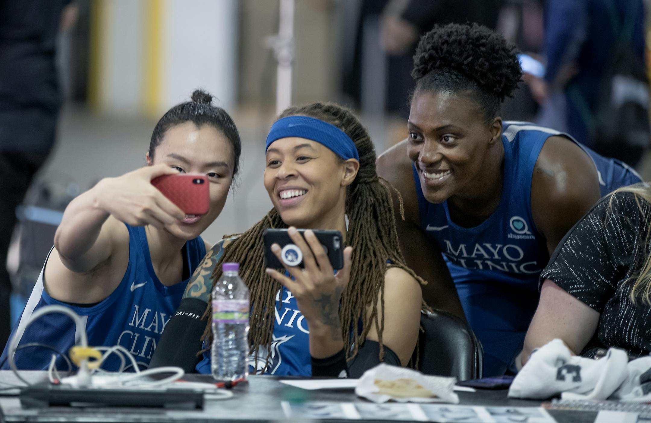 Minnesota Lynx players Shao Ting, left, Seimone Augustus, center, and Sylvia Fowles stopped for a selfie during Media day at the Target Center, Thursday, May 16, 2019 in Minneapolis, MN.