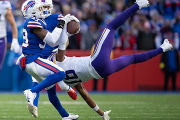 Minnesota Vikings wide receiver Justin Jefferson (18) caught a deep pass in overtime on Buffalo Bills cornerback Cam Lewis (39) in Orchard Park.,N.Y. 