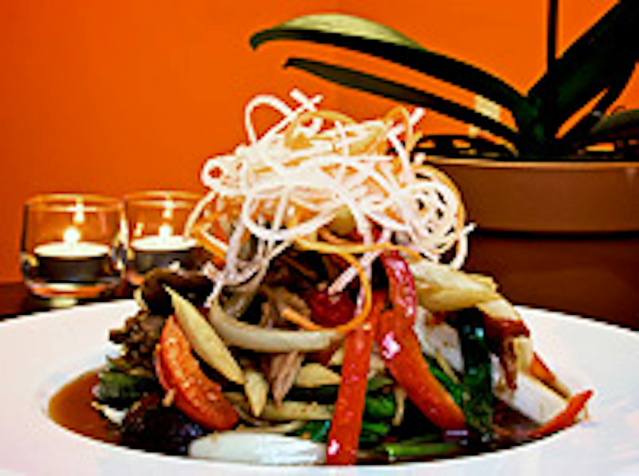 Mango Thai's ginger roasted duck has boneless duck topped with crushed garlic and hot chili pepper.