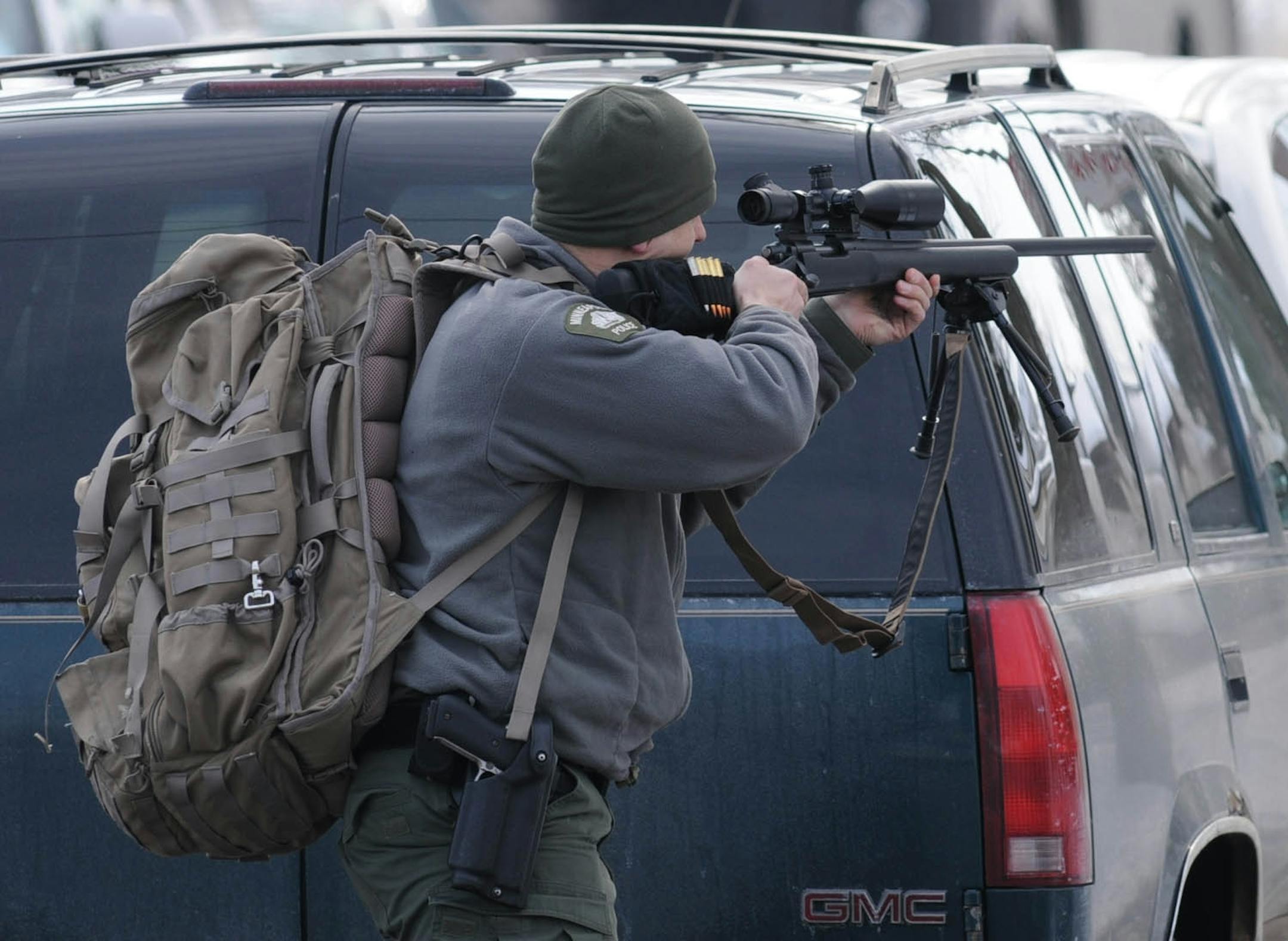 Police standoff at Dowling Ave N and Aldrich Ave involving a man with a gun in a house on Aldrich Ave N