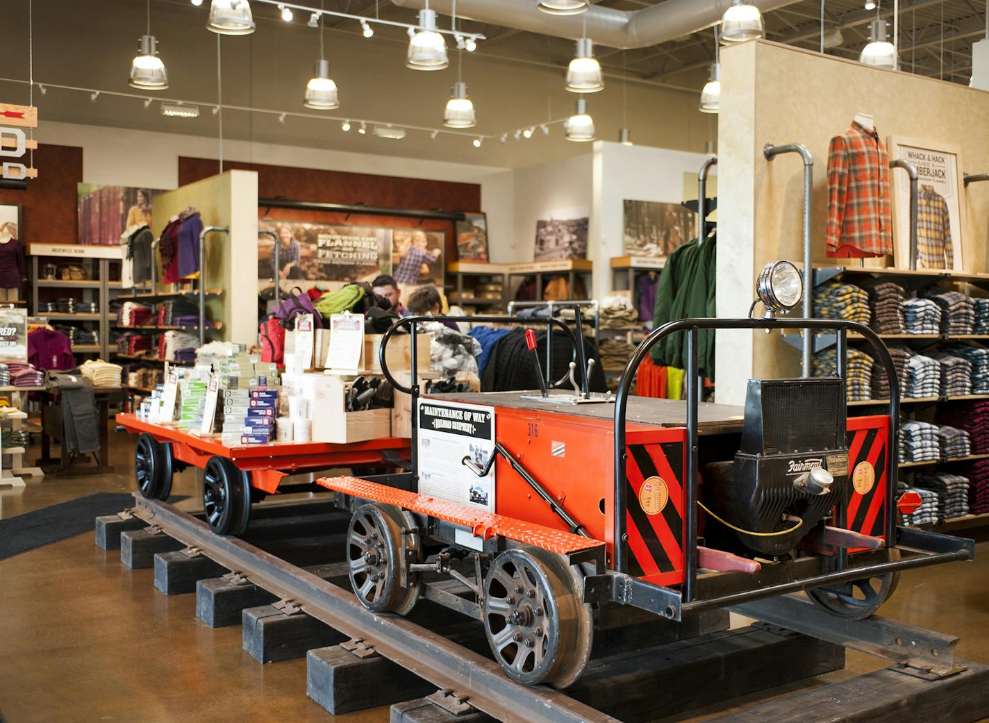 An old fashioned rail car with merchandize as display in store.