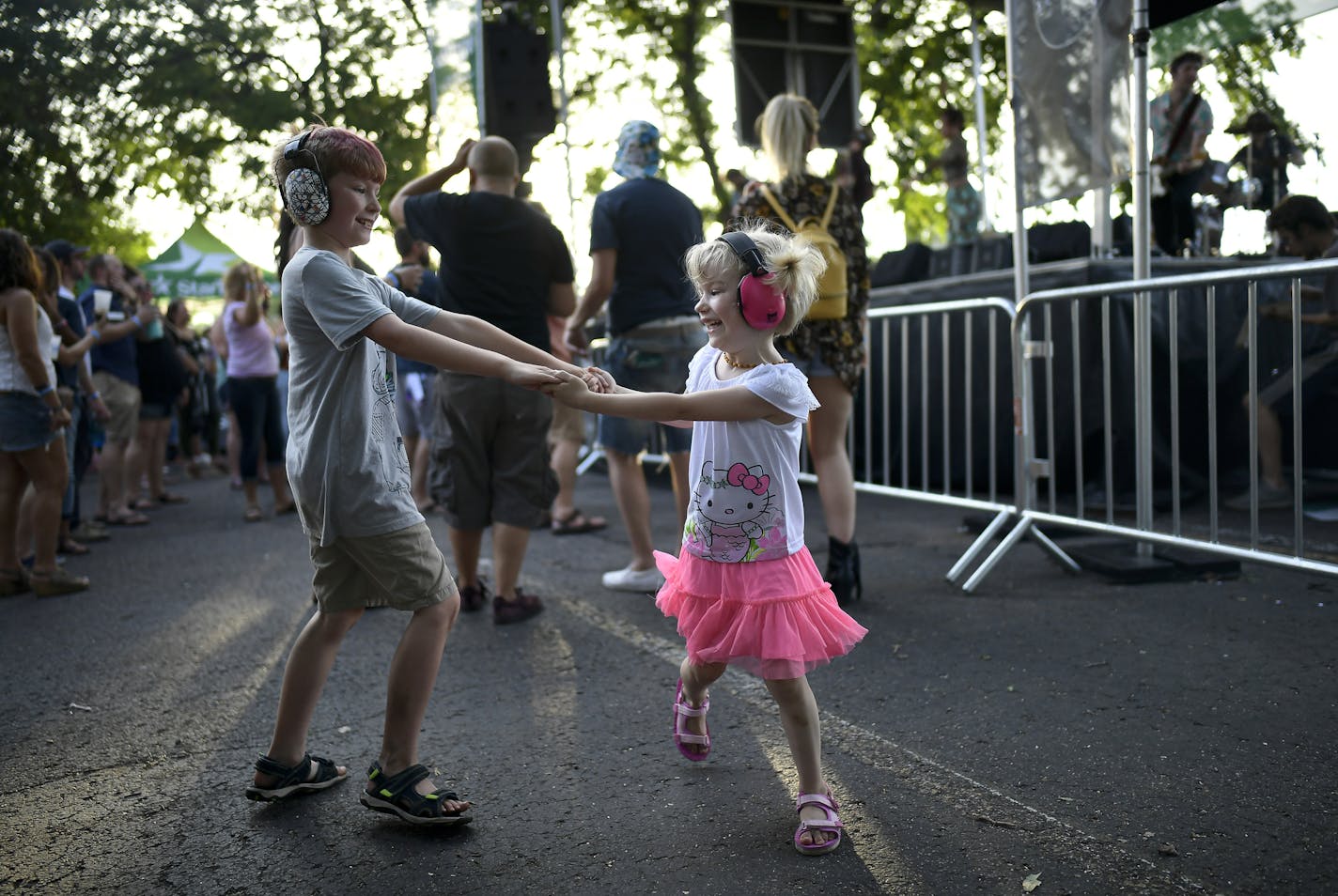 Siblings Robert Dusseau, 9, and Maura Long, 4, danced as Kiss The Tiger performed at the Basilica Block Party Friday night. ] Aaron Lavinsky &#xa5; aaron.lavinsky@startribune.com The Basilica Block Party was held Friday, July 12, 2019 at the Basilica of St. Mary grounds in Minneapolis, Minn.