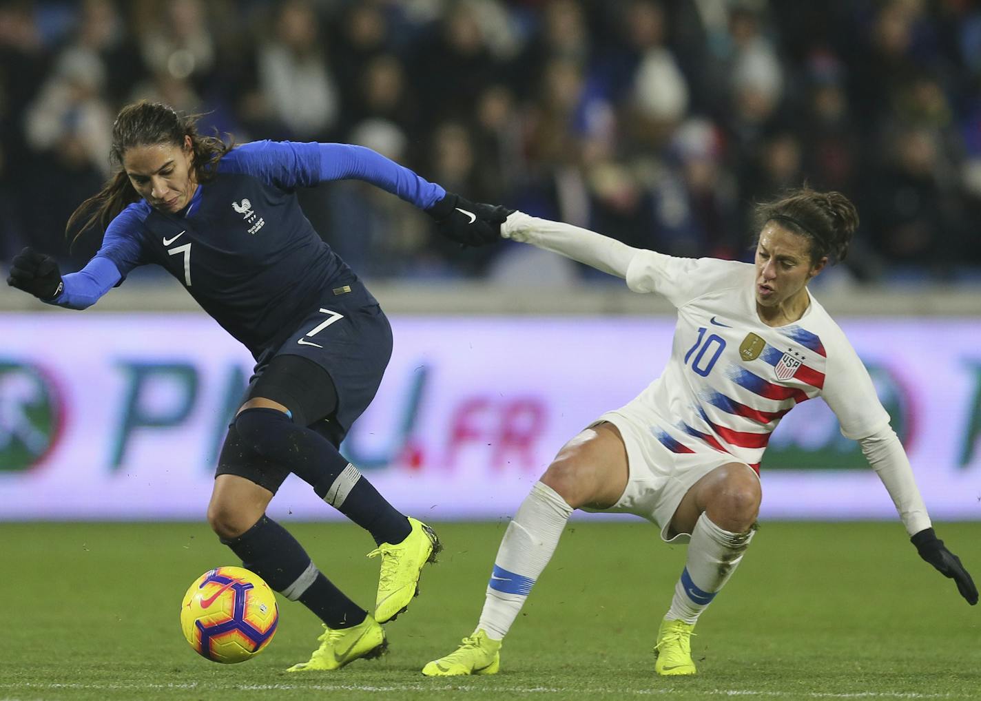 France defender Amel Majri, left, vies for the ball with US forward Carli Lloyd during a women's international friendly soccer match between France and United States at the Oceane stadium in Le Havre, France, Saturday, Jan. 19, 2019. France won 3-1. (AP Photo/David Vincent)