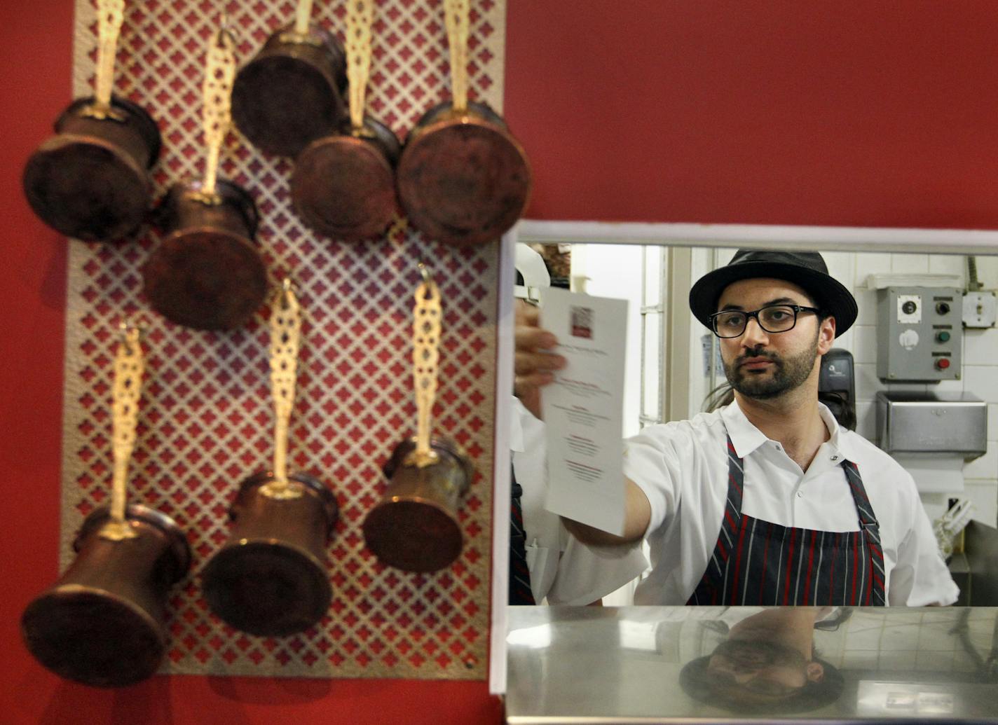 Sameh Wadi works in the kitchen at Saffron, his restaurant in Minneapolis, Minnesota, on April 6, 2012. (Tom Wallace/Minneapolis Star Tribune/MCT) ORG XMIT: MIN2012122523412727