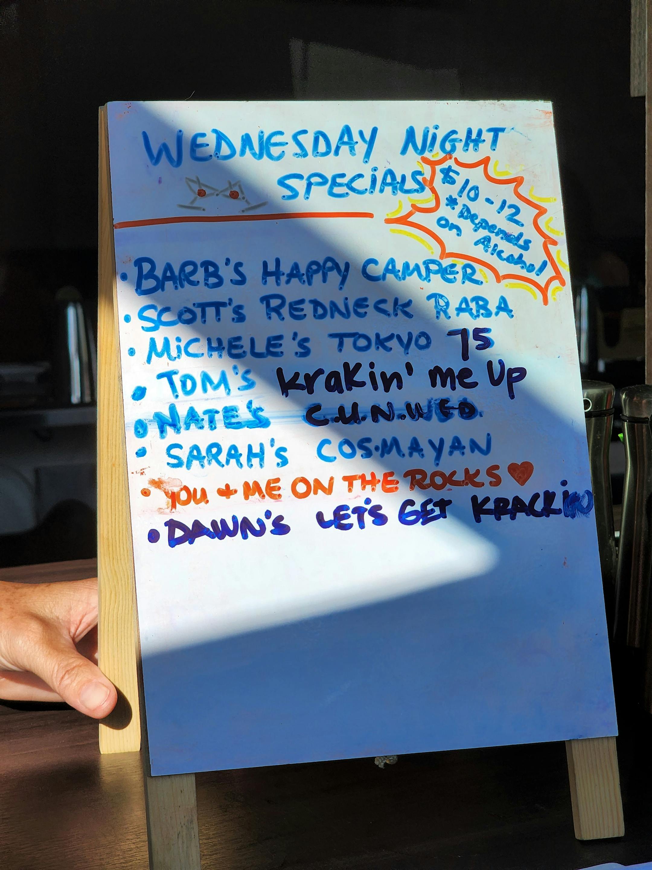 A whiteboard with drink names