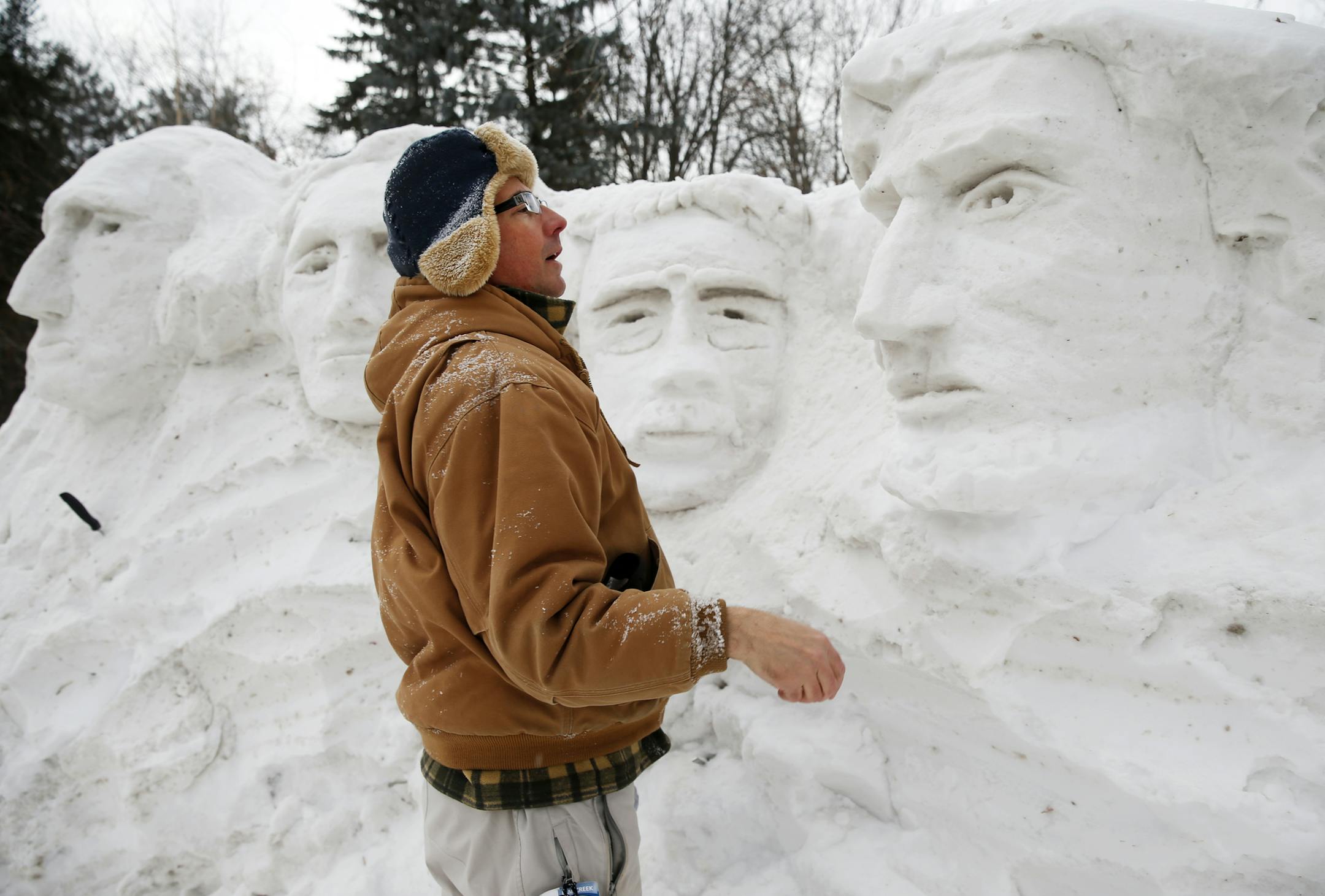 In front of his home in Minnetonka, artist David Holmes created a replica of Mount Rushmore out of snow in his front yard. His favorite carving is Lincoln, far right. ]richard tsong-taatarii/rtsong-taatarii@startribune.com