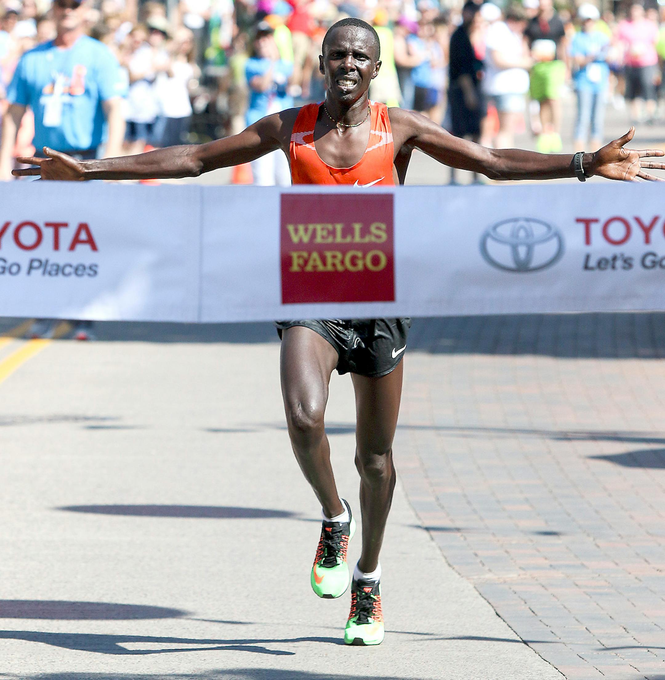 Kenya�s Elisha Barno celebrates at the finish line of Grandma's Marathon in Duluth Saturday. Barno repeated his championship with at time of 2 hours, 11 minutes, 26 seconds.