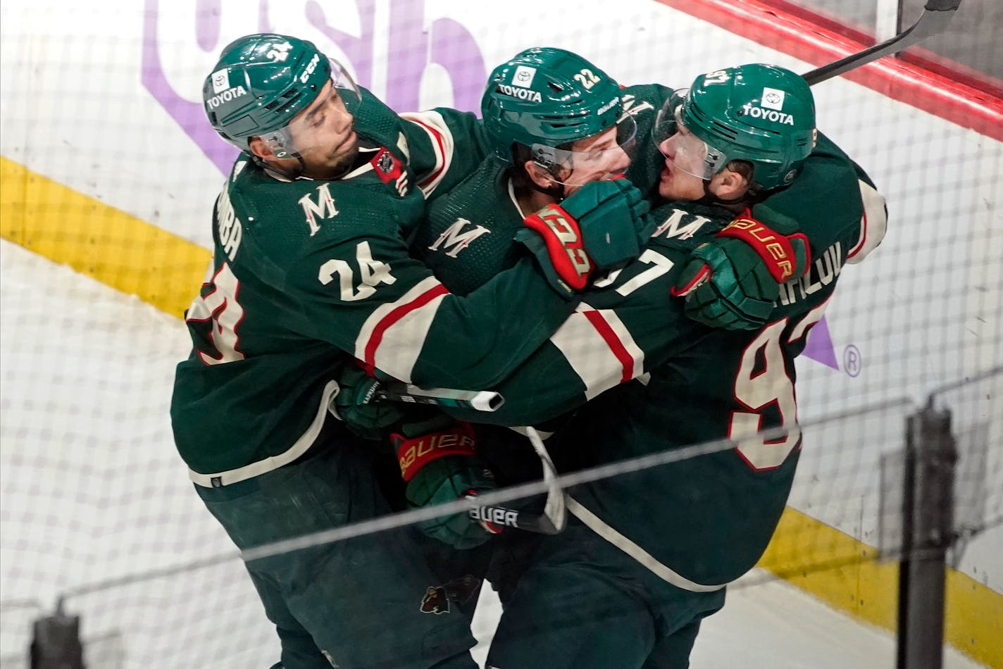 Minnesota Wild's Matt Dumba, left, and Kevin Fiala celebrate the goal by Kirill Kaprizov, right, in overtime against Ottawa Senators goalie Filip Gustavsson in an NHL hockey game Tuesday, Nov. 2, 2021, in St. Paul, Minn. Fail had an assist on the goal. (AP Photo/Jim Mone)