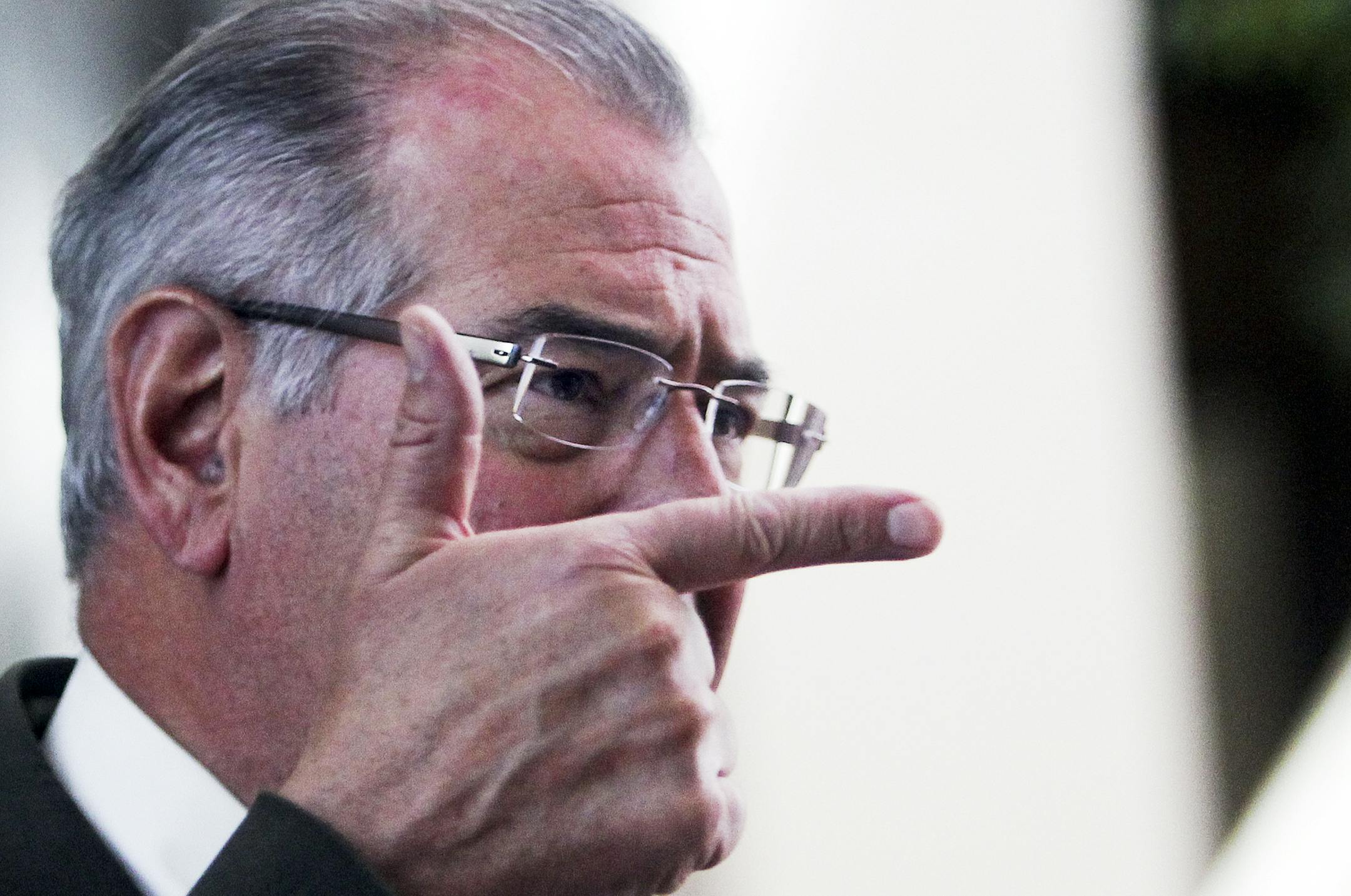 Hennepin County Attorney Mike Freeman demonstrated with his hand how he said Eddie Mosley put a gun to the heads of the victims.