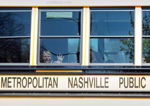 A child wept while on the bus leaving the Covenant School in Nashville, Tenn., after a mass shooting at the school on Monday. (Nicole Hester/The Tennessean via AP)