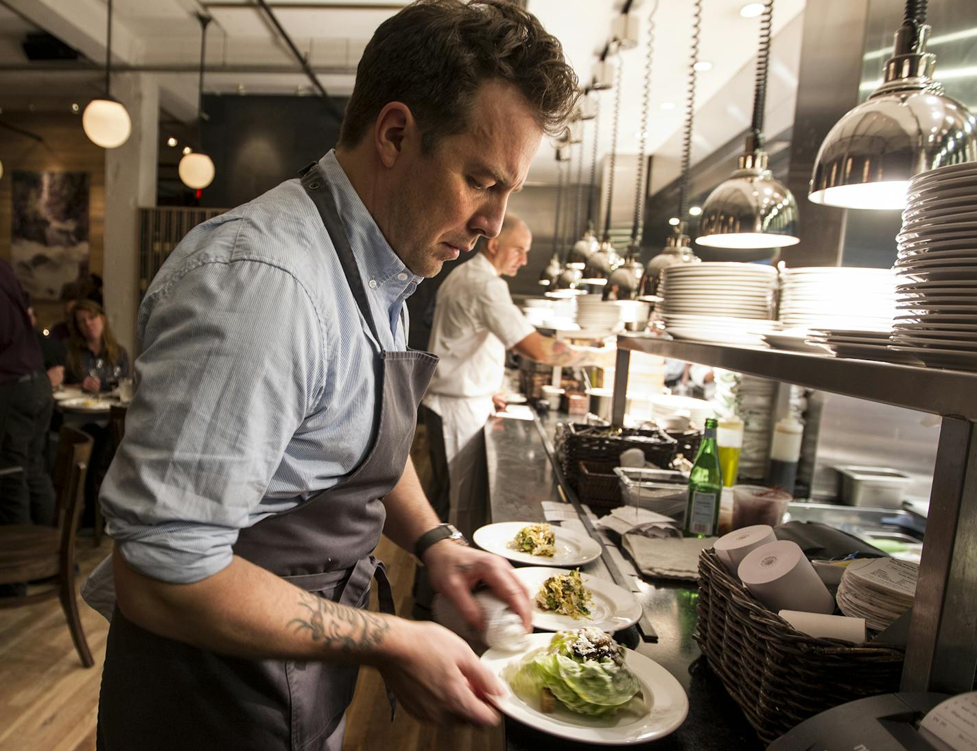 Executive chef and owner Isaac Becker keeps plate aesthetics tight at Burch Steakhouse and Pizza Bar December 13, 2013. (Courtney Perry/Special to the Star Tribune)