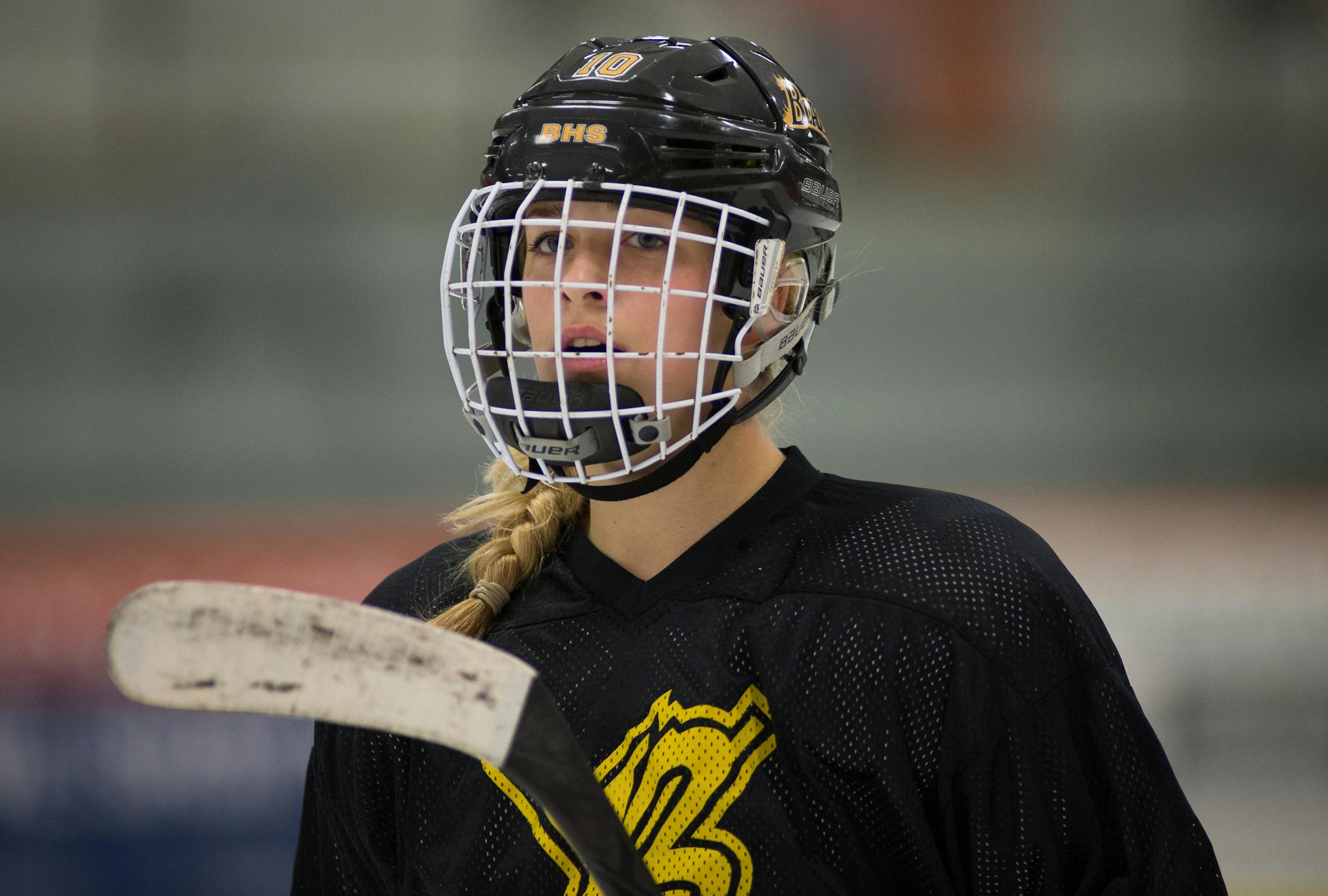 Burnsville senior forward and captain, Tay Burke, looks to her teammates while coming off the ice during a break in play at Friday's scrimmage. ] AARON LAVINSKY • aaron.lavinsky@startribune.com The Burnsville Blaze scrimmaged against the Farmington Tigers at Schmitz-Maki Arena Friday, October 31, 2014 in Farmington. Farmington won the scrimmage with an unofficial score of 5-1.