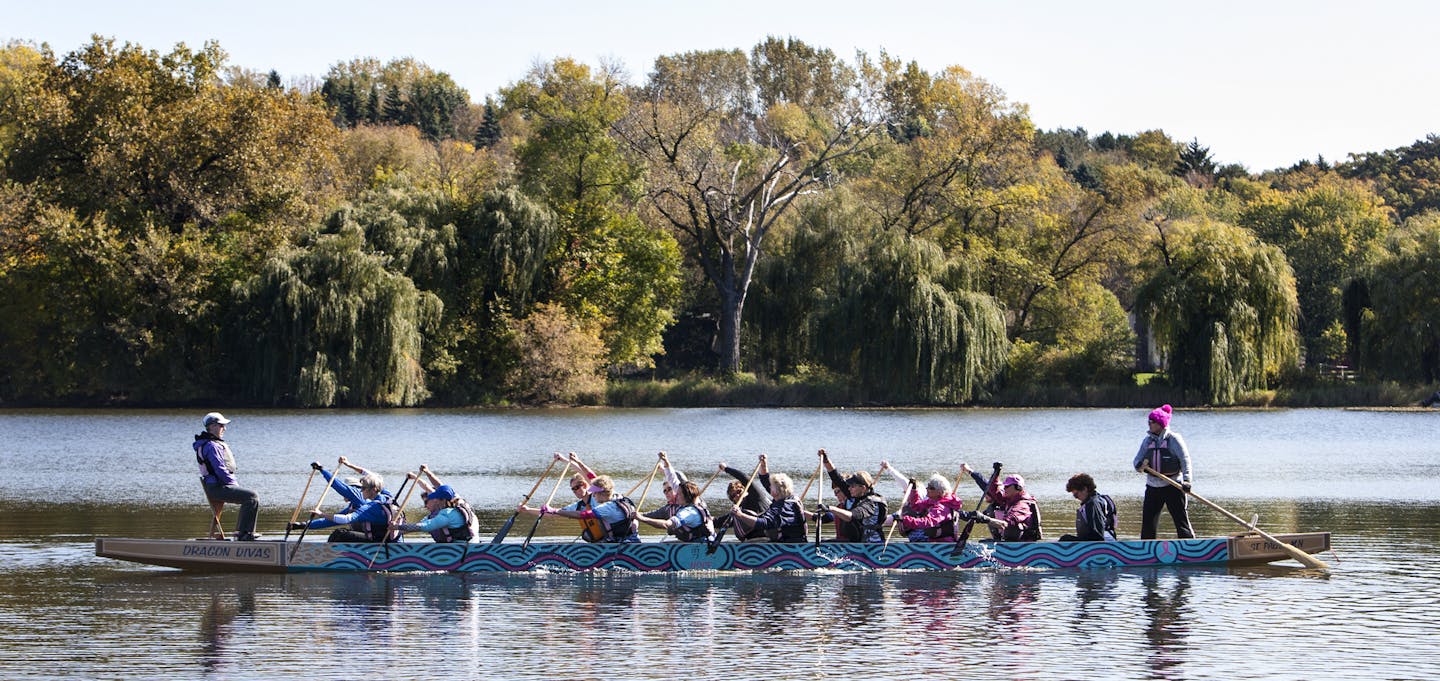 The Courage team of the Dragon Divas train on Lake Gervais in Little Canada October 11, 2014. The Courage team meets twice a week, and a separate Hope team meets weekly. (Courtney Perry/Special to the Star Tribune)