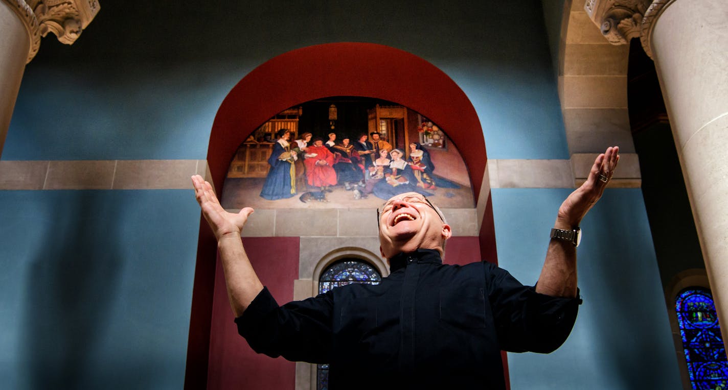 Rev. Joseph Weiss with the mural of St. Thomas More and his family. ] GLEN STUBBE * gstubbe@startribune.com Tuesday, June 21, 2016, On Sunday, parishioners at the Catholic Community of St. Thomas More will dedicate a painting of their patron saint by a local artist and fellow parishioner. The work is the result of a pulpit plea by the Rev. Joseph Weiss, who thought the project would help a parish that is the combination of two previous churches continue to heal and move forward from what had bee