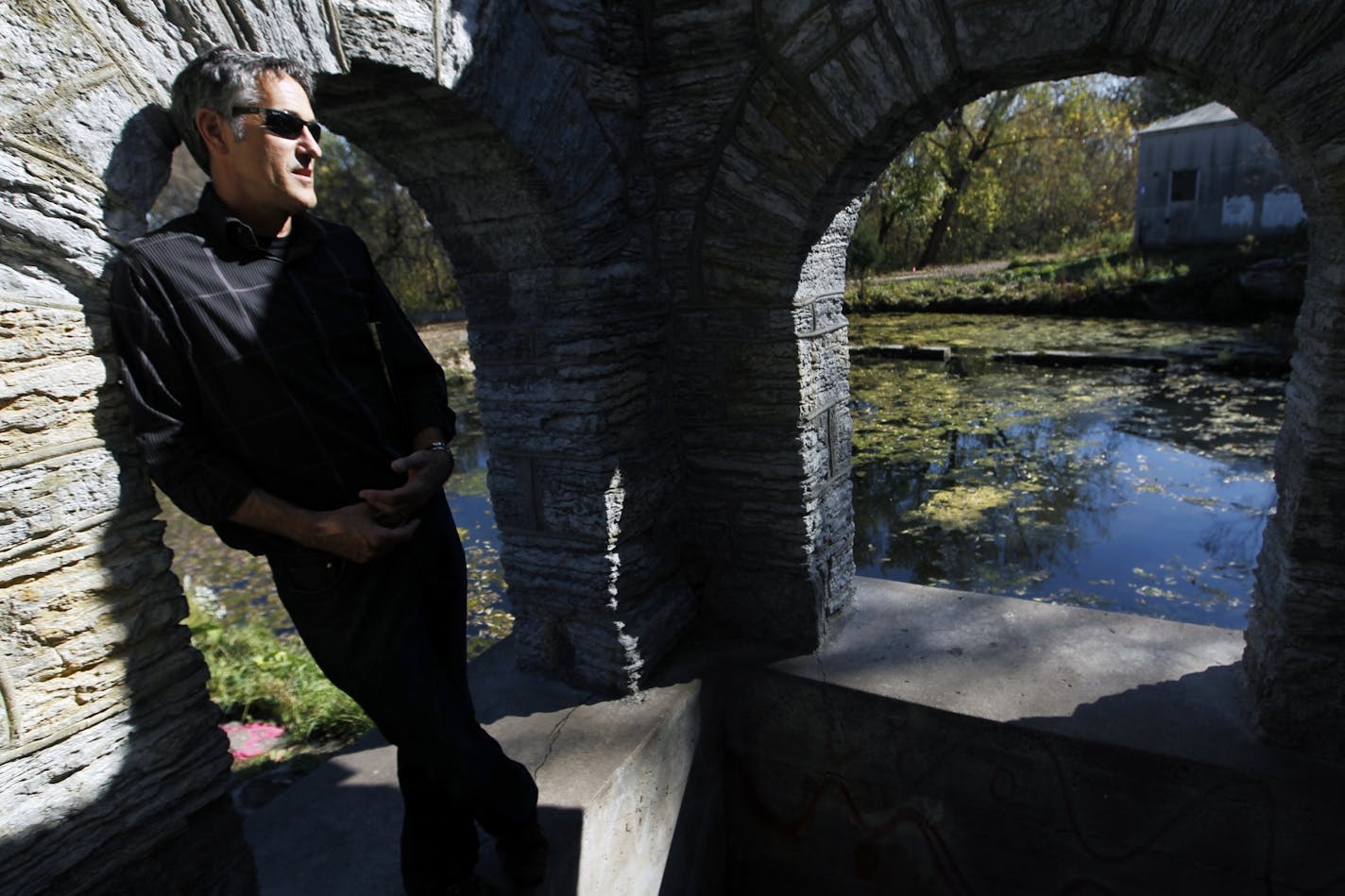 Alan Robbins-Fenger, a Park Service planning and land-use specialist, stood on the spring house of the Coldwater Spring source. The 27-acre area targeted for renovation sits between Fort Snelling and Minnehaha Park and formerly was owned by the Bureau of Mines.