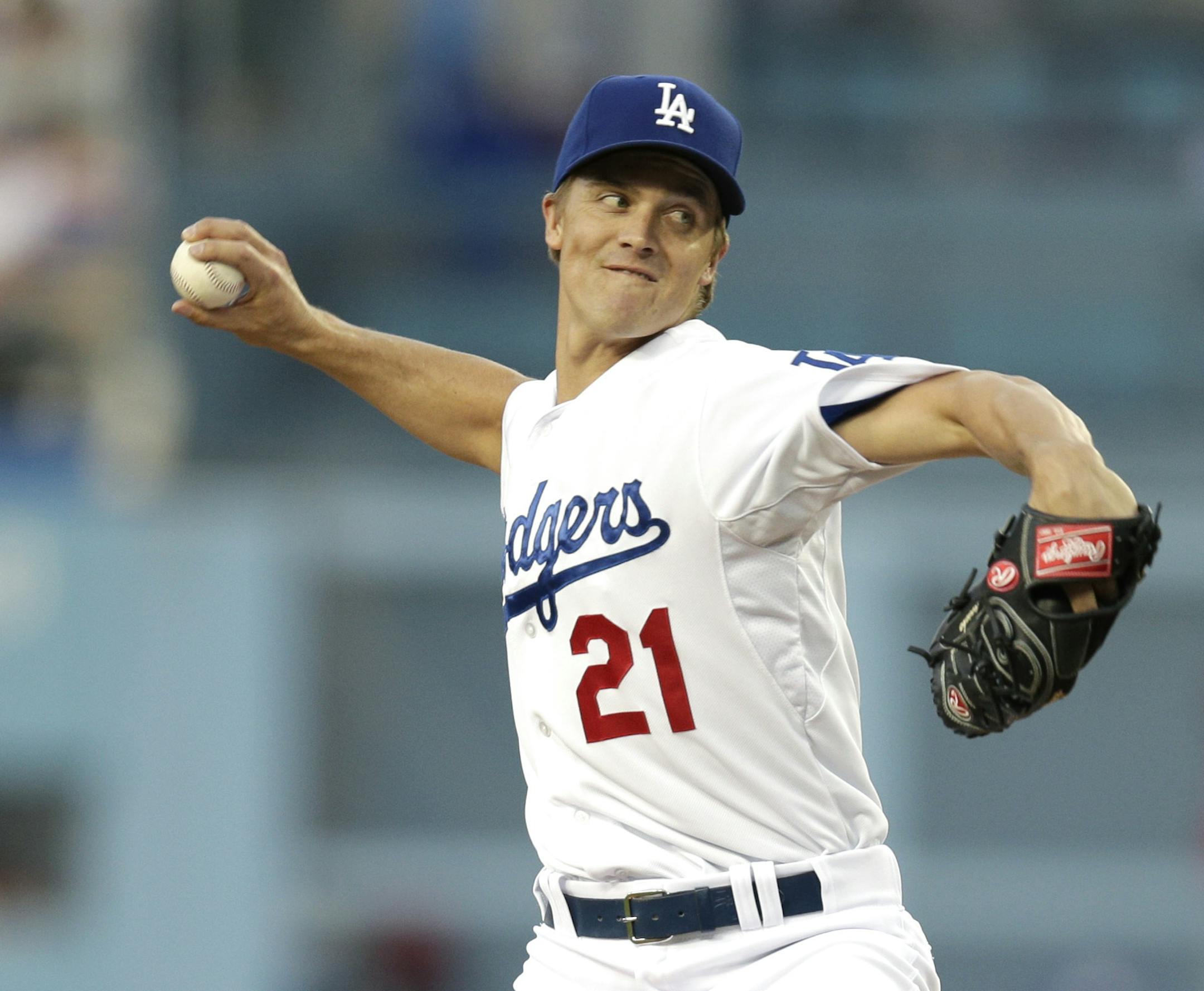 Los Angeles Dodgers starting pitcher Zack Greinke throws to a Philadelphia Phillies batter during the first inning of a baseball game Wednesday, April 23, 2014, in Los Angeles. (AP Photo/Jae C. Hong)