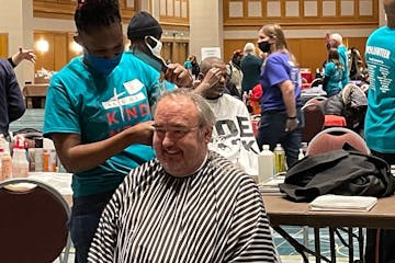 Haircuts mean happy faces at the annual 3,000 Acts of Kindness event Dec. 12.