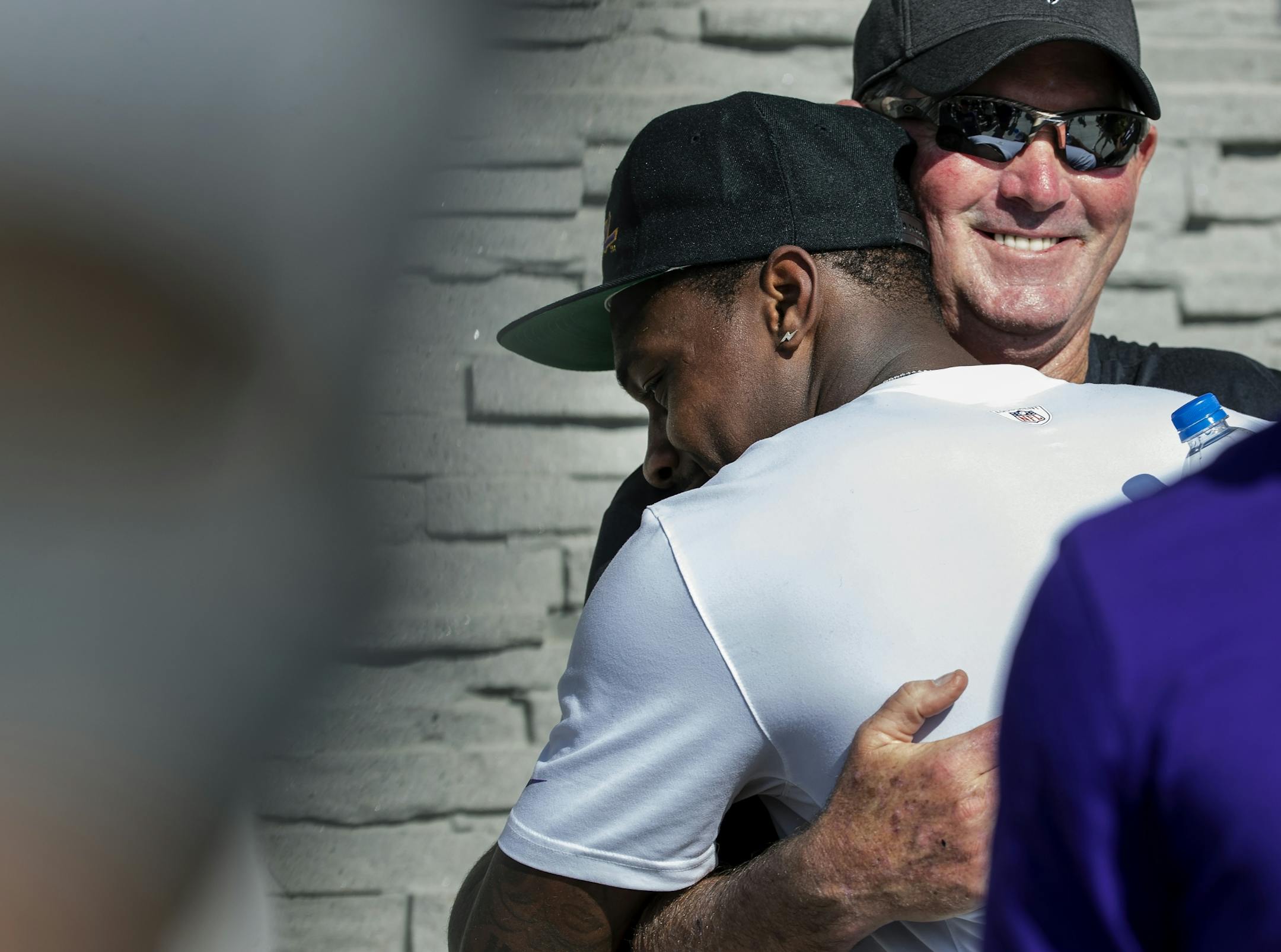 Minnesota Vikings receiver Stefon Diggs (14) got a hug from head coach Mike Zimmer after practice on Tuesday. Diggs signed a 5-year extension with the team.