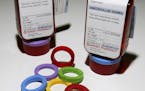 Prescription bottles and colorful rings that make up the ClearRx prescription system are shown in New York Wednesday, April 27, 2005. Target pharmacie