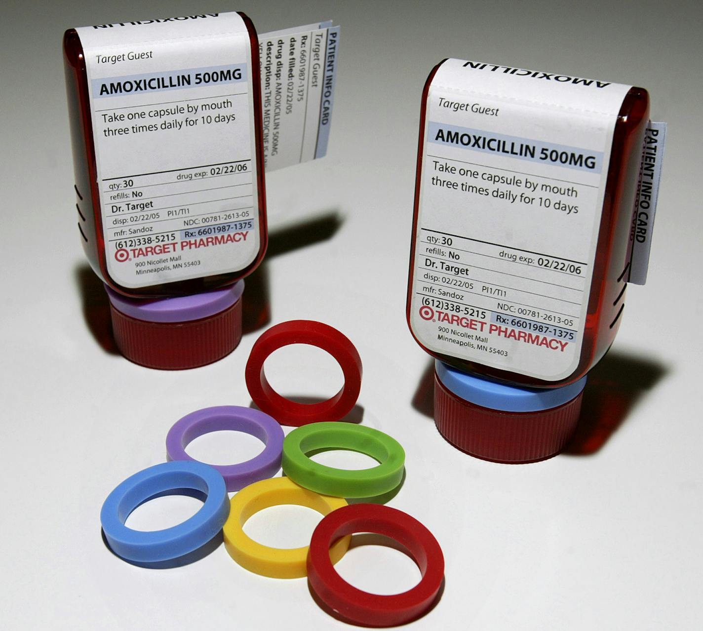 Prescription bottles and colorful rings that make up the ClearRx prescription system are shown in New York Wednesday, April 27, 2005. Target pharmacies this month rolled out the flattened bottle with easier-to-read labels and plastic rings that can color-code the bottles for each family member. (AP Photo/Gregory Bull) ORG XMIT: NY861