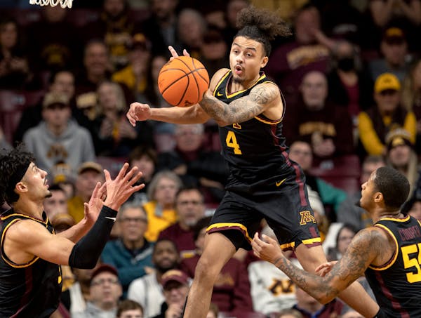 Braeden Carrington (4) of the Minnesota Gophers reaches for a rebound in the first half Monday, Jan. 16, 2023, at Williams Stadium in Minneapolis, Min