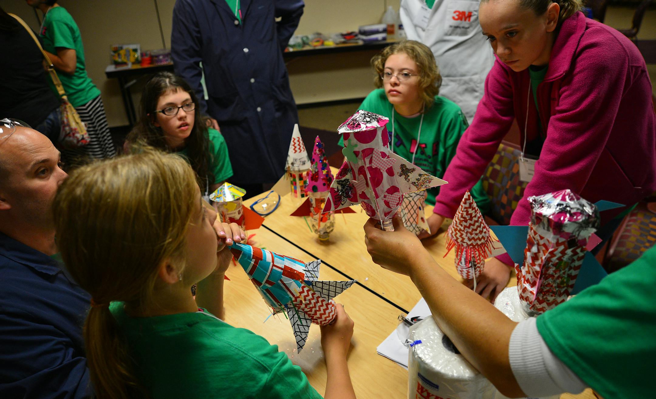 Disabled girls from throughout Minnesota will be in the Twin Cities this week to take part in a camp that promotes science, engineering and math. Scientists - many of them disabled themselves, will be teaching the girls about rocket science, computer programming and biomedical science. On Friday August 9, 2013, technology experts from 3M helped the girls design and blast off bottle rockets. The kids were designing their rockets for distance, accuracy and looks. Here one team worked on choosing r