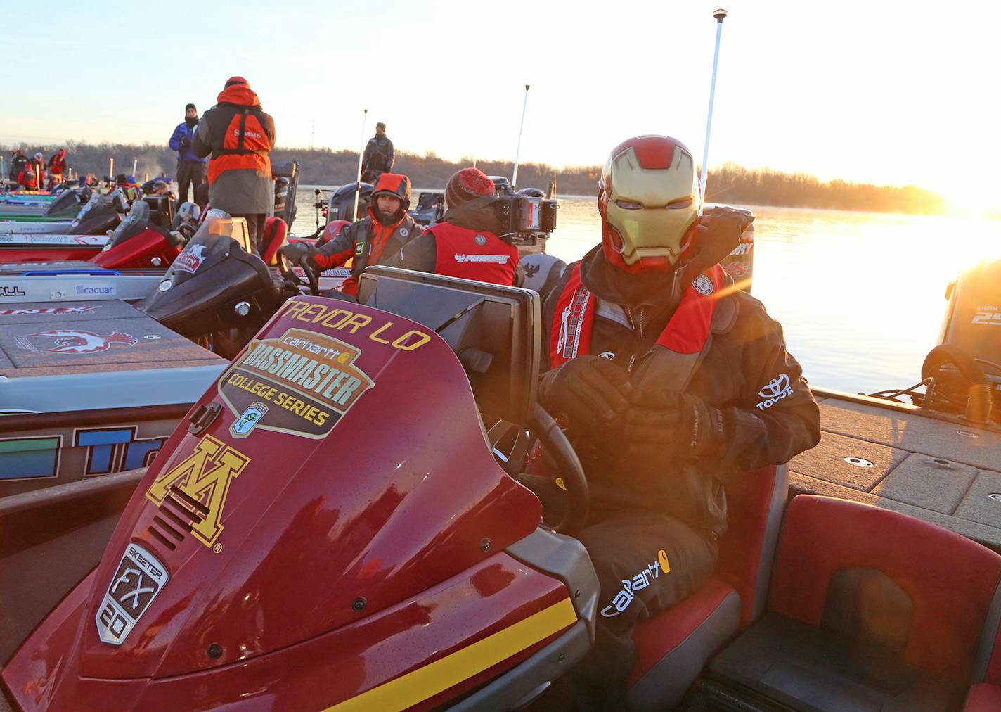 Preparing to run his boat about 25 miles on Grand Lake, Okla., in temperatures hovering in the mid-30s just after dawn Wednesday, Trevor Lo of St. Paul donned a hard plastic face mask in preparation for this week's Bassmaster Classic. Lo was granted entry into the prestigious tournament by winning the individual collegiate national bass fishing title while fishing on the University of Minnesota team.