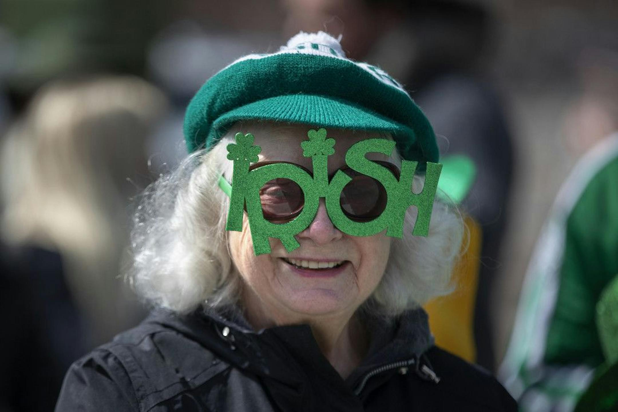 Donna Pochie wears 'Irish' glasses during the South Side Irish Parade Sunday, St. Patrick's Day, March 17, 2019, in Chicago.