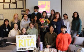 Rita Li (center) and St. Paul Academy's Rubicon staff.