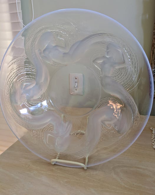 Lalique plate is worth $2,300 to $3,000.