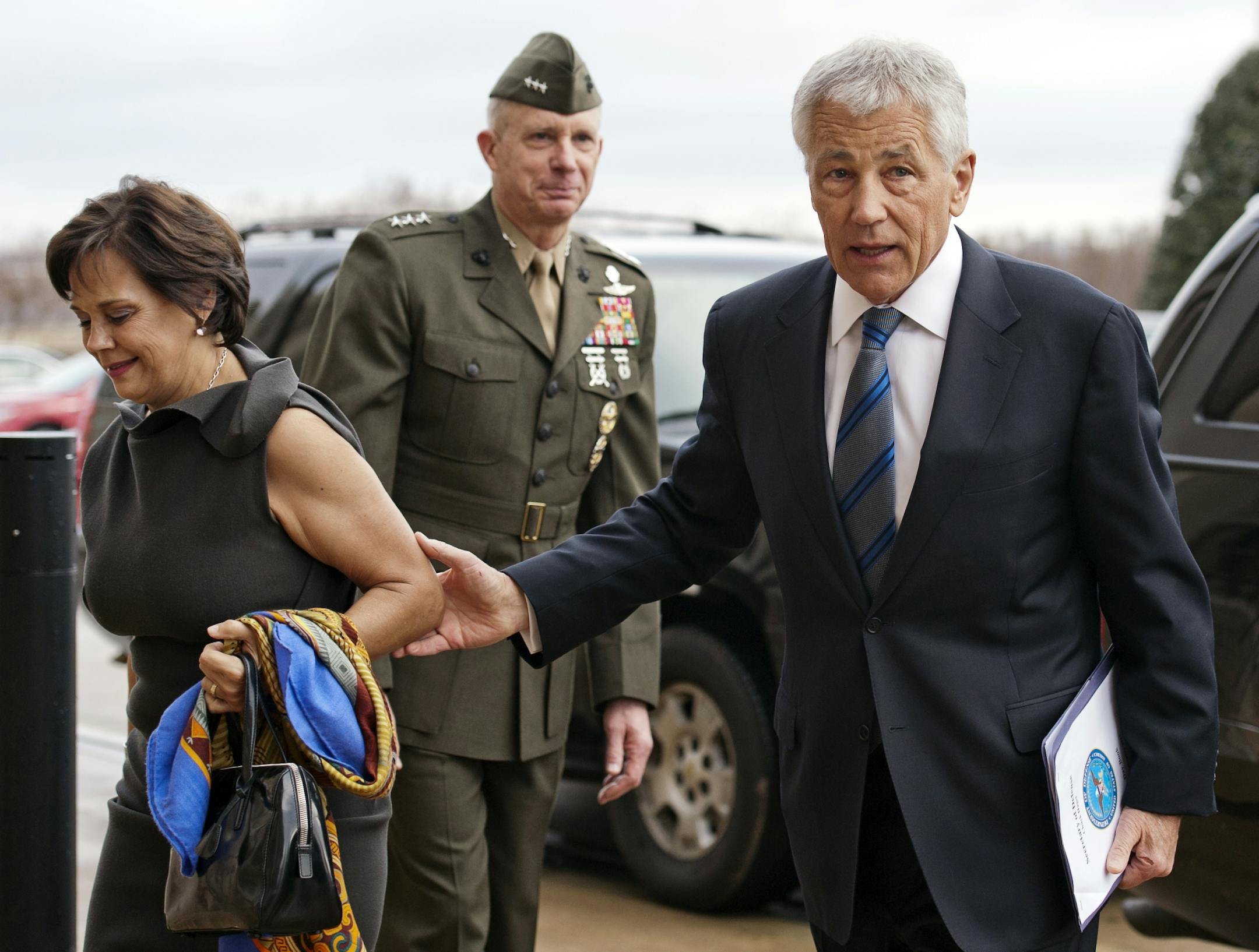 Marine Corp. Lt. Gen. Tom Waldheuser, center, greets Sen. Chuck Hagel, R-Neb., right, and his wife Lilibet, as they arrive at the Pentagon to be sworn-in as Secretary of Defense, in Arlington, Va., on Wednesday.