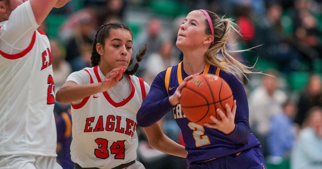 Kennedy Sanders took on Eden Prairie’s Vanessa Jordan (34) during Chaska’s victory in the Park Center Holiday Tournament. Sanders scored 22 points in the game.