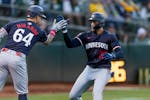 The Twins' Royce Lewis, right, is congratulated by Jose Miranda after he hit a solo home run against the Athletics during the sixth inning in Oakland,