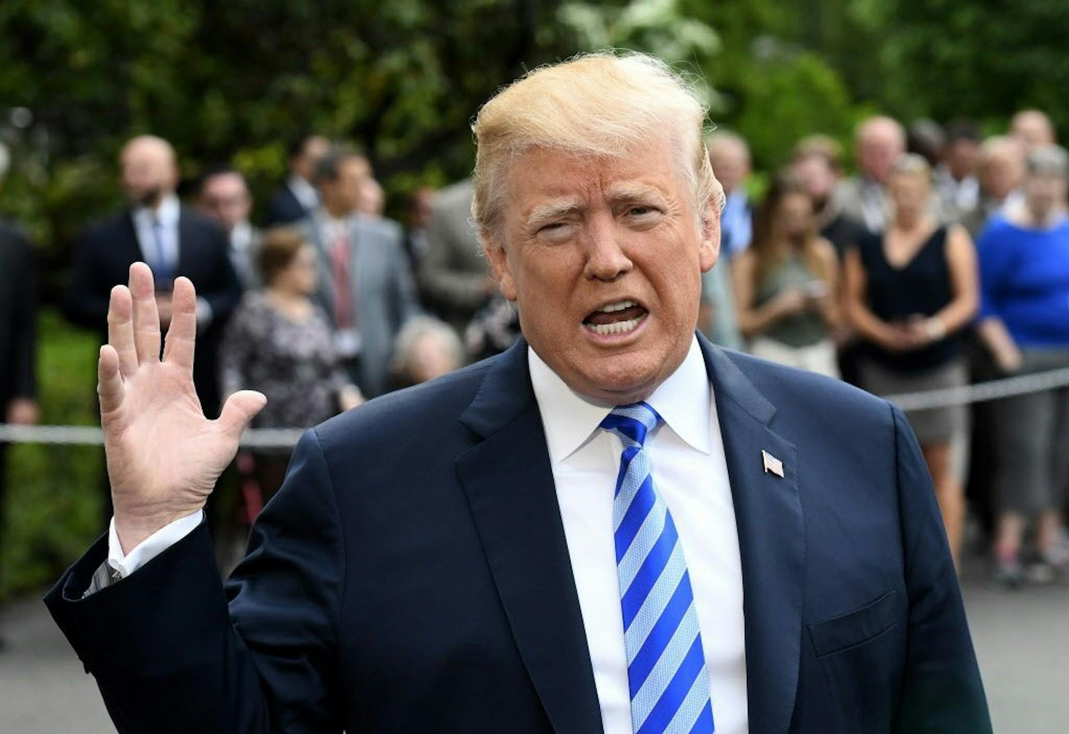 U.S. President Donald Trump speaks to reporters while departing from the White House, on Friday to speak to the NRA in Dallas.