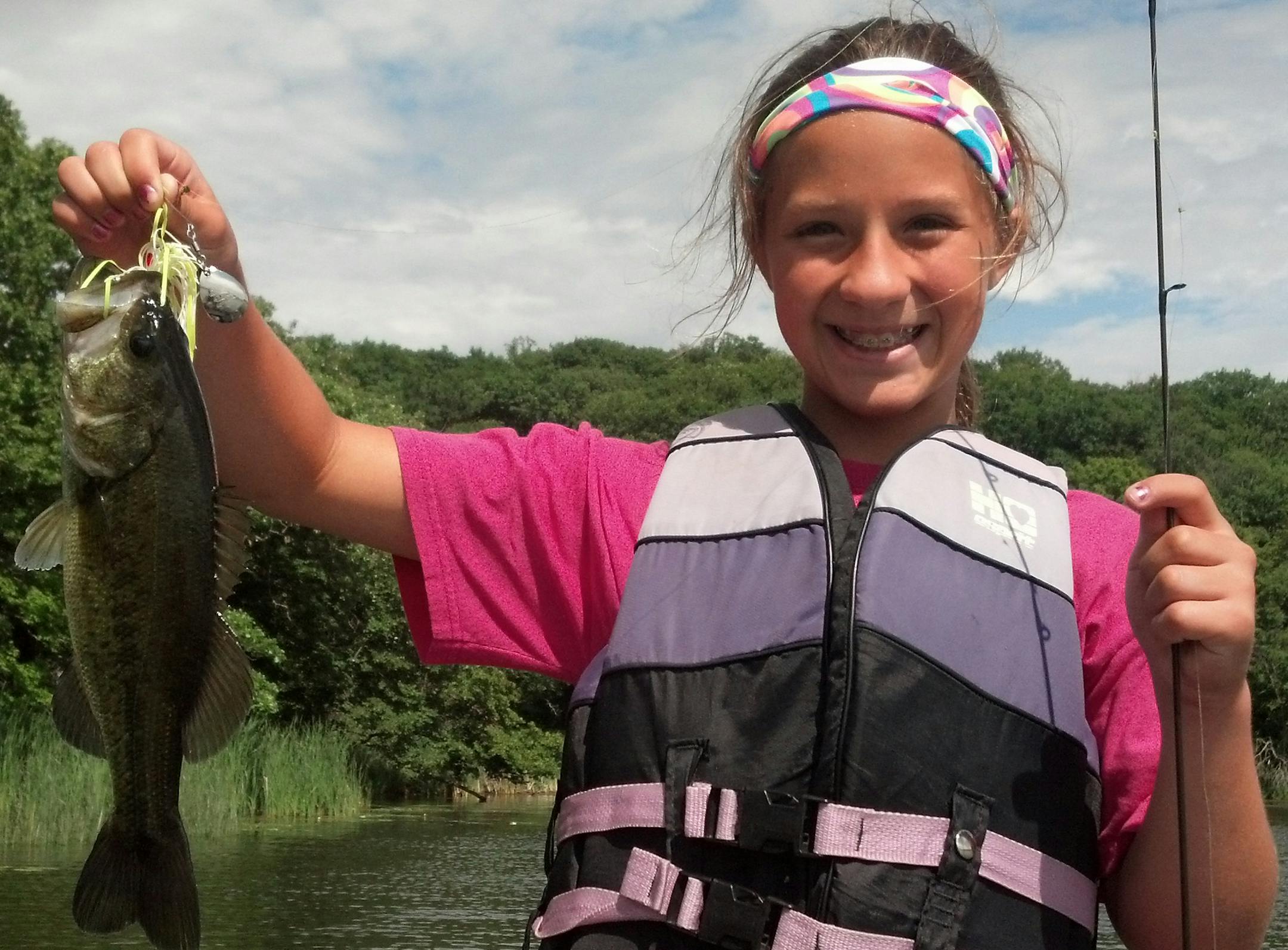 DAY OF FIRSTS
Maddie Brandt, 12, of St. Bonifacius had a day of firsts recently on a west metro lake: The first time she used spinning gear (which she mastered quickly), first time using artificial bait, first time fishing for bass and first time catching a bass. She and her grandpa and his fishing student friend caught seven bass, all released to be caught again.