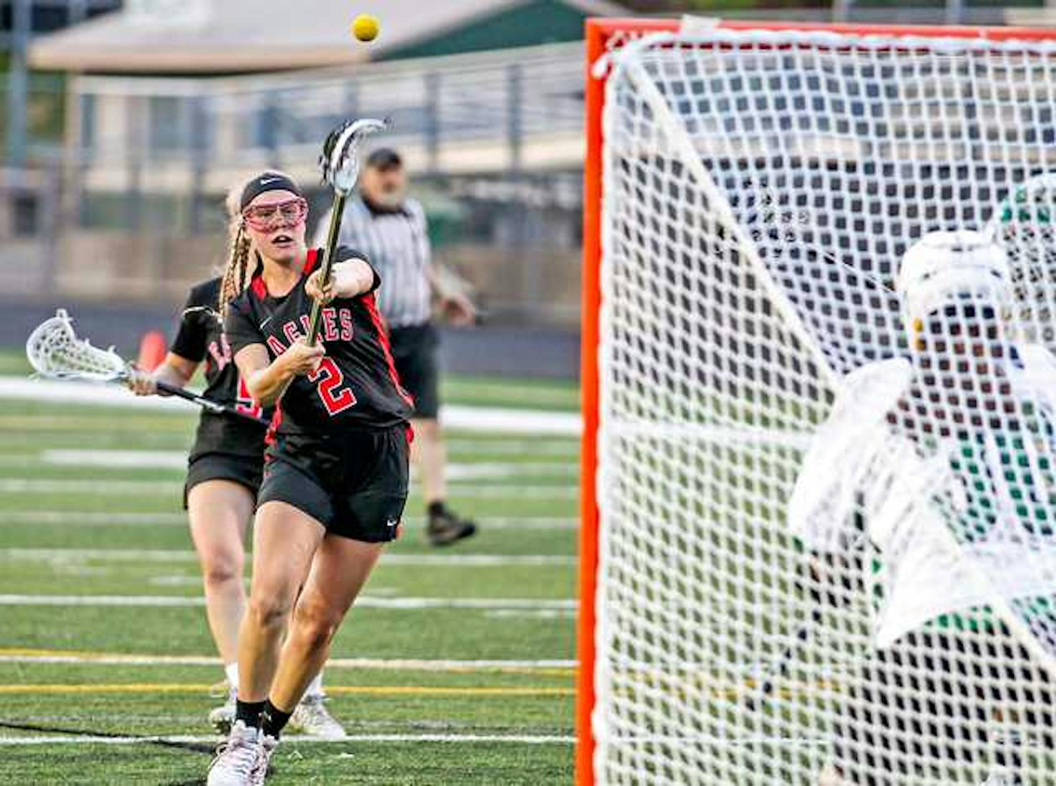 Eden Prairie's Naomi Rogge, shown scoring a goal against Edina earlier this season, was named the Eagles' Athena Award winner, the latest honor given to one of the most decorated athletes in the school's history.