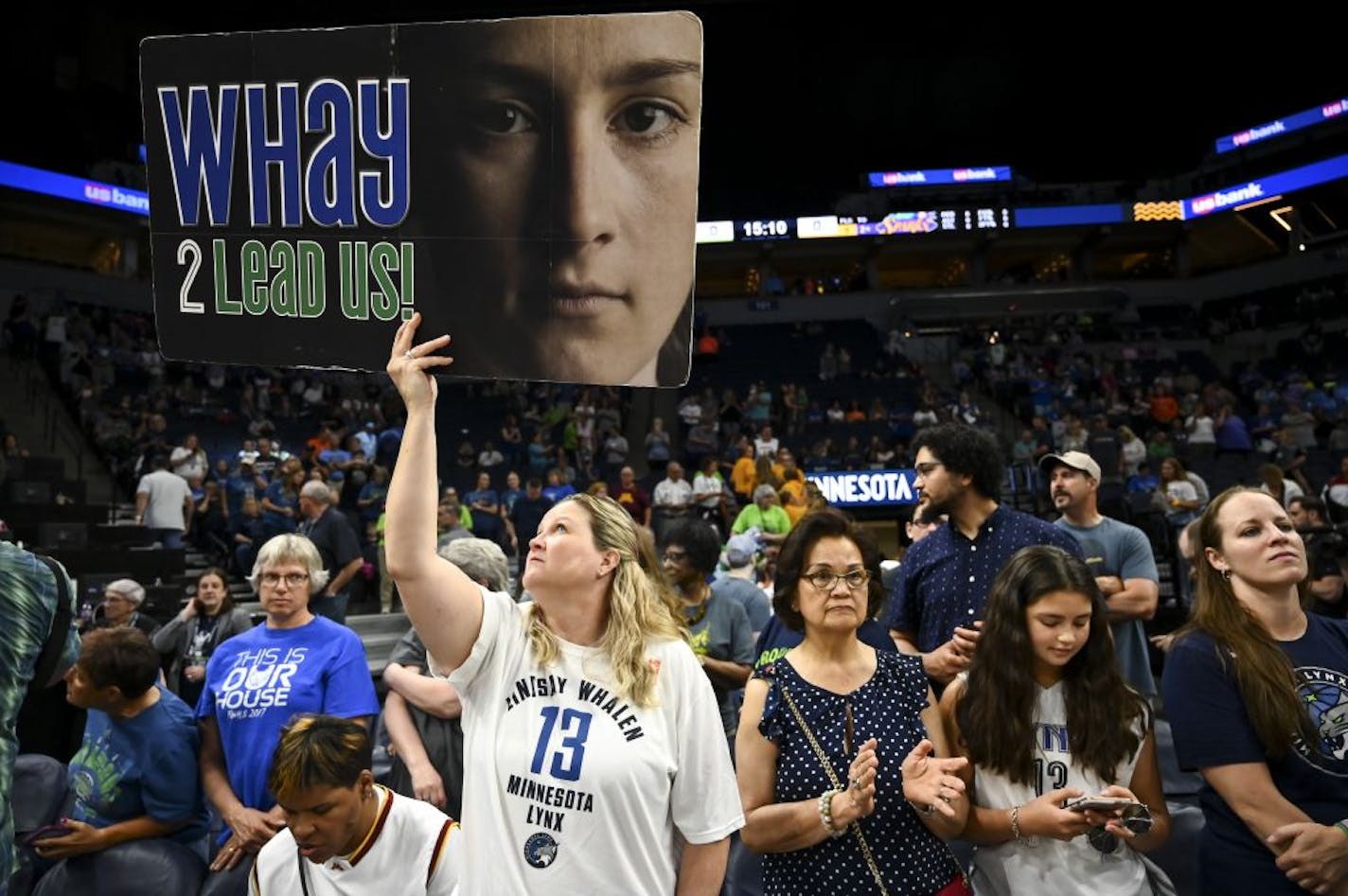 Amy Capitola, of Robbinsdale, held up a Lindsay Whalen sign before the start of Saturday's game against the Los Angeles Sparks. She's been a season ticket holder since 2010 when Whalen joined the Lynx.