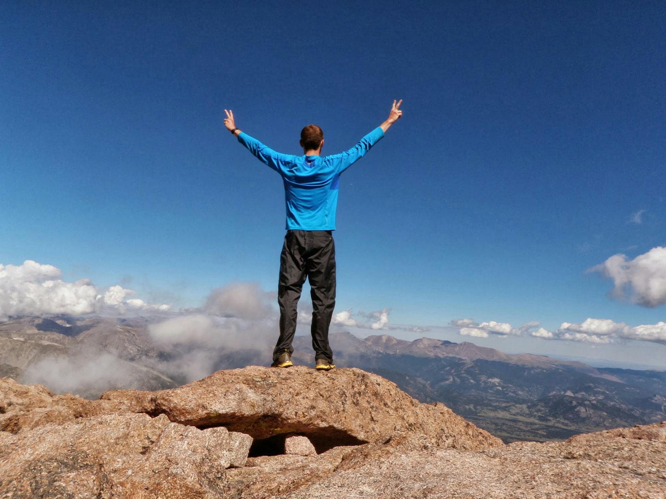 PHOTO COURTESY DAN HOBBS. Hobbs, relaxed and relieved, celebrates the final day of a climb of 57 mountain peaks in 24 days as a fundraiser for Save the Children .