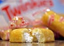 FILE - This July 15, 2013 file photo shows Twinkies in Gilbert, Ariz. It was a year of culinary comebacks. Wonder bread, Twinkies and a host of other 