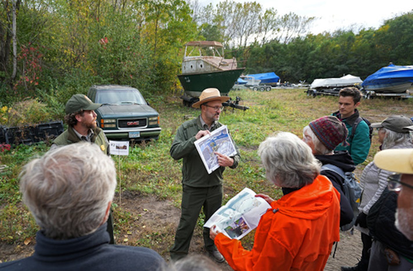 Dan Dressler with the National Park Service, shows where the River Learning Center building will be, which now is a parking lot for boat storage. The City of Saint Paul and Great River Passage Conservancy, in partnership with Mississippi Park Connection, the National Park Service and Your Boat Club, invited members of the public to attend an celebration to review the final schematic design for the future Mississippi River Learning Center Thursday, Oct. 6, 2022 in St. Paul, Minn. The Mississippi River Learning Center is a city-led project combining a mixed-use, river-focused space and a National Park Service headquarters at the Crosby Farm Regional Park, serving as a national gateway to the Mississippi River with year-round river learning and outdoor recreation experiences on and along Saint PaulÕs river. ] Brian Peterson ¥ brian.peterson@startribune.com