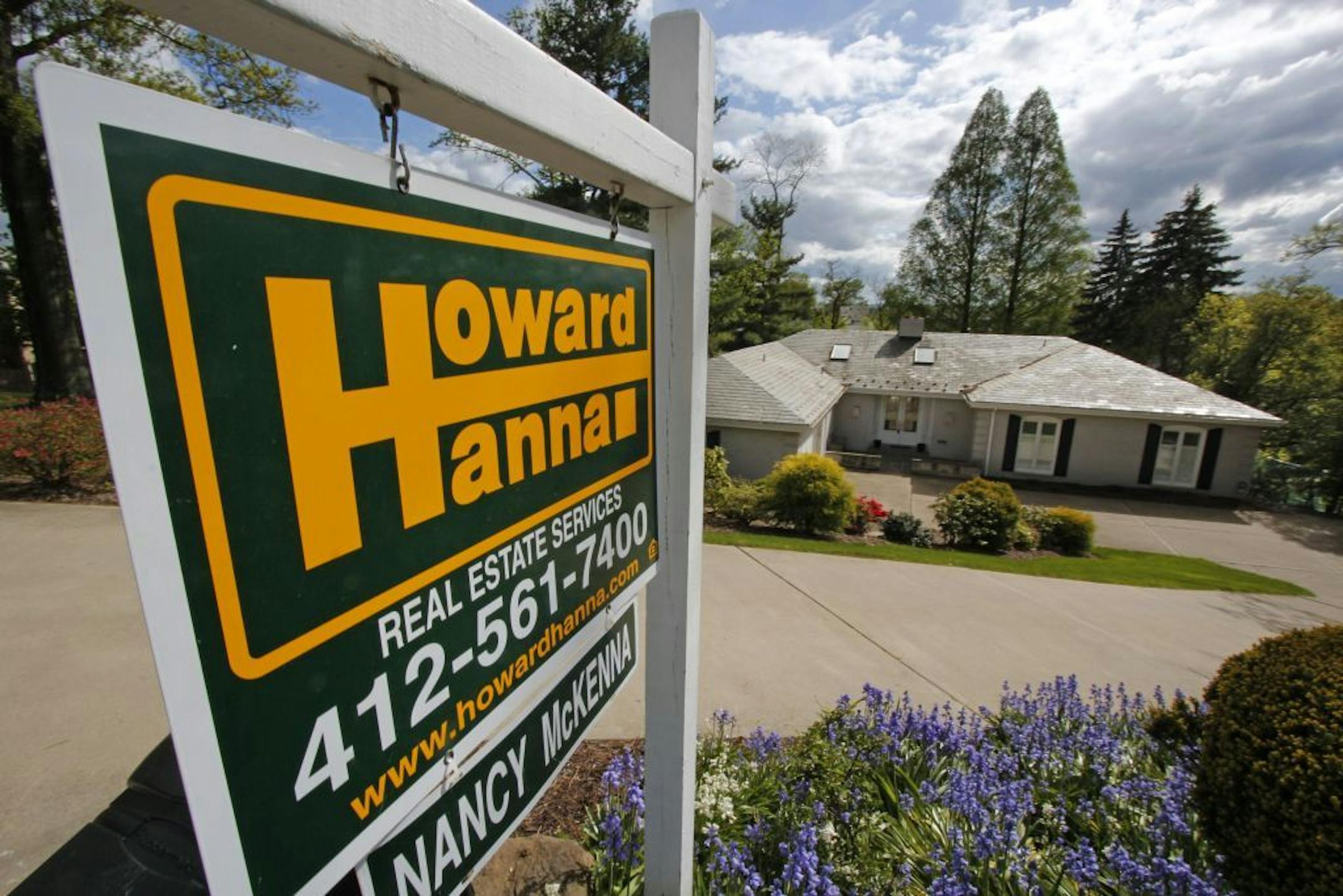 In this Monday, May 6, 2013, photo, a home is for sale in Mt. Lebanon, Pa