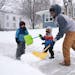 Ricky Bibuka got some help from his sons Kingston, 4, and Lachlan, 2, as he shoveled the sidewalk in front of their home Friday in northeast Minneapol