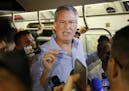 FILE - In this July 23, 2017 file photo, New York Mayor Bill de Blasio talks to reporters on the subway in New York. De Blasio wants to tax the wealth